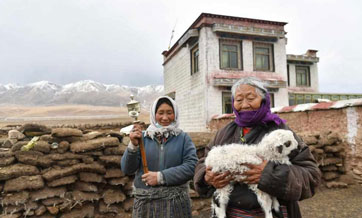 Former serf enjoys happy life after democratic reform in Tibet