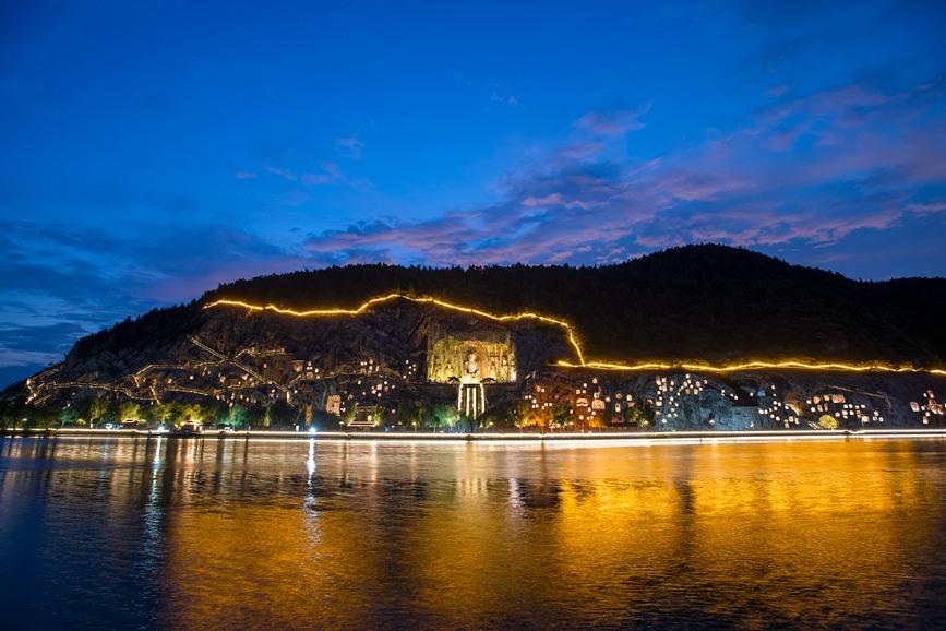 Grottoes in central China welcome vistors at dusk