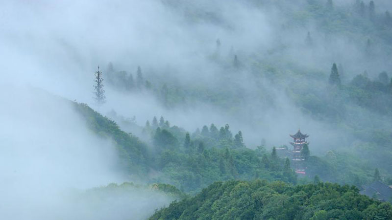 Mist and cloud hover over Huaying Mountain in Sichuan