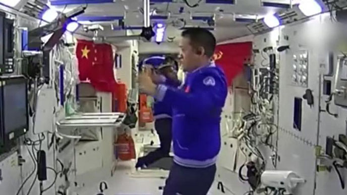 Shenzhou-12 astronauts work out in spacecraft