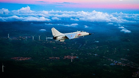 Fighter bombers fly through clouds