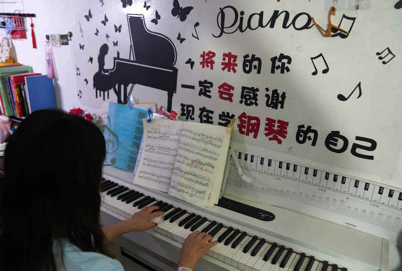 Migrant worker-turned-piano tuner fulfills her dreams in east China's Zhejiang Province