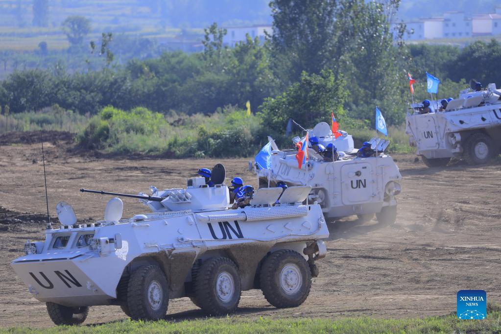 Soldiers from Mongolia participate in a live drill on peacekeeping at a combined-arms tactical training base of the Chinese People's Liberation Army (PLA) in central China's Henan Province, Sept. 9, 2021. China on Monday started holding an international peacekeeping drill code-named "Shared Destiny-2021." It is the first time the Chinese military has organized such a multi-national live drill on peacekeeping, with the participation of troops from countries including China, Mongolia, Pakistan and Thailand. (Xinhua/Liu Fang)