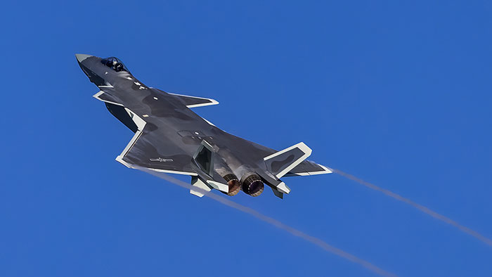 Chinese J-20 stealth fighter jet flies in the sky above Zhuhai