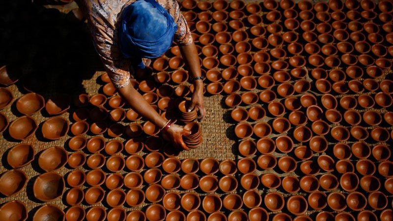 Nepalese prepare clay pots for Hindu festival "Tihar" in Bhaktapur