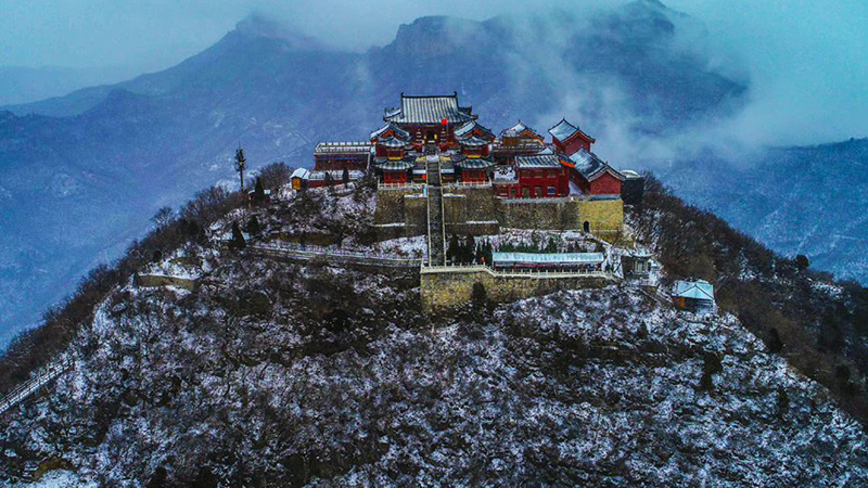 Yuntai Mountain in Central China's Henan: Shimmering silver snows adorn scenes of red autumnal leaves