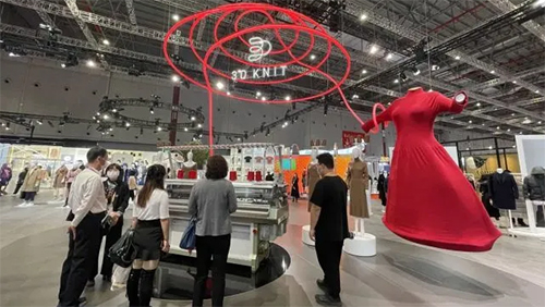 “Flawless” 2.5-meter-tall 3D seamless knitted dress draws the limelight at 4th CIIE