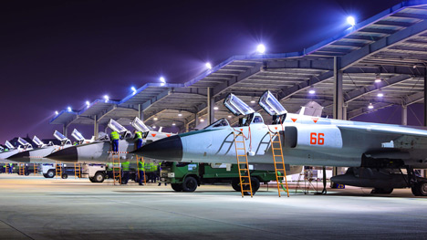 Fighter bombers receive pre-flight checks