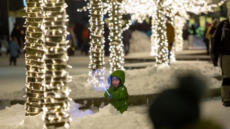 People enjoy Christmas lights in Ogre, Latvia