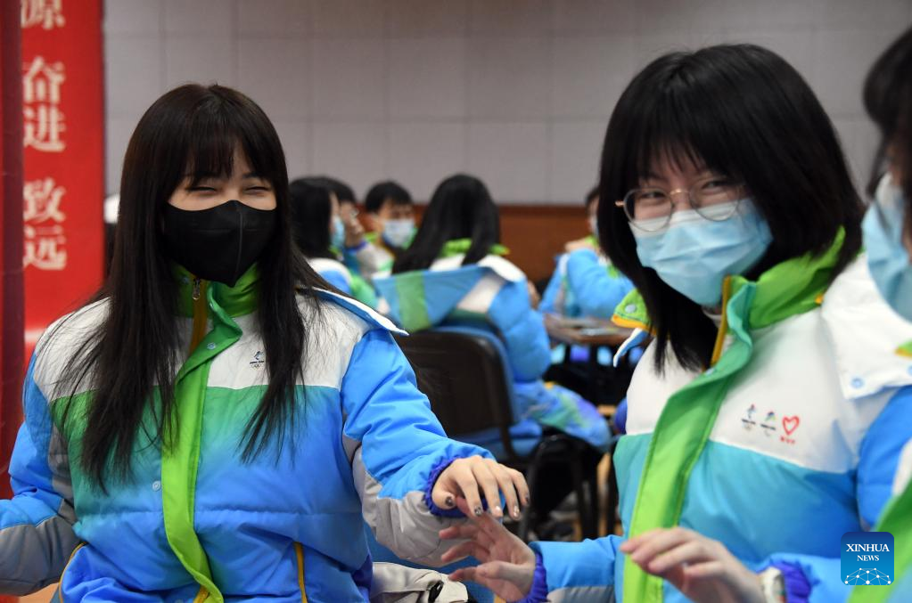 Volunteers for Beijing Olympics attend training session to develop skills