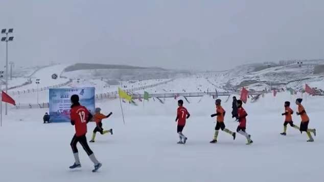 Students play snow football game in Xinjiang
