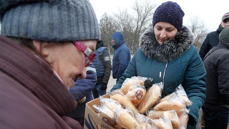 Local residents receive humanitarian aid in village of Anadol in Donetsk