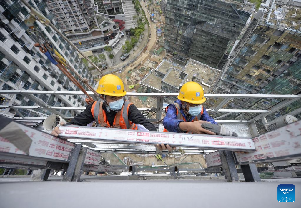 Workers work on construction site during Labor Day holiday in Chengdu