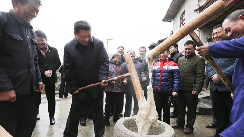 Xi makes snacks, fights poverty