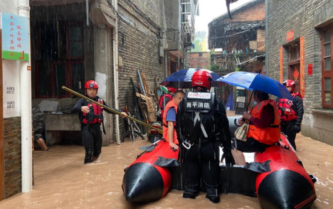 Rescuers evacuate stranded people in flood water in Nanping, SE China