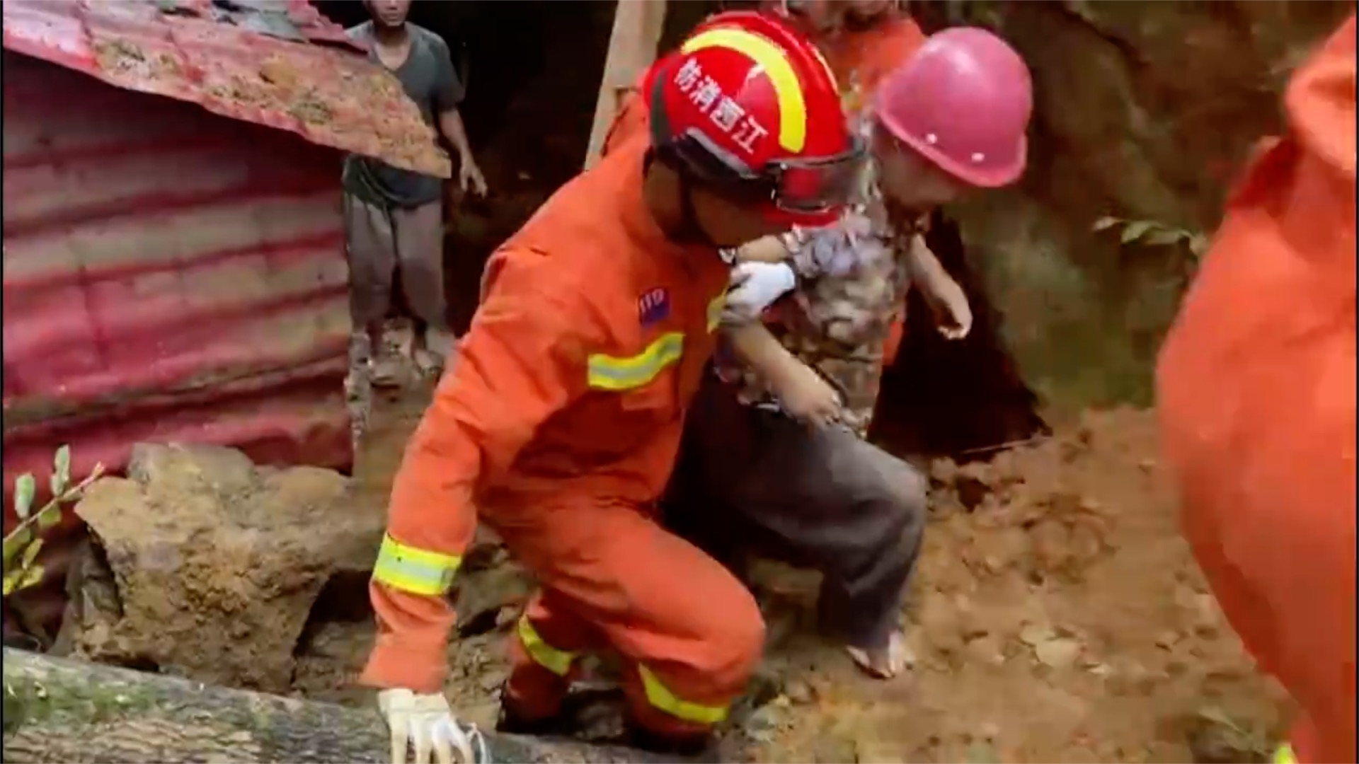 Firefighters rescue woman trapped by landslide in E China
