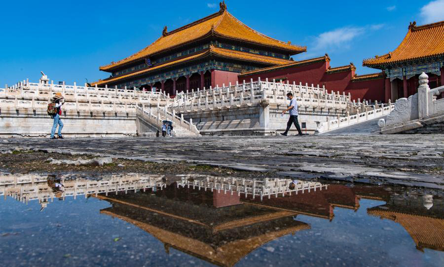 Charming mirror scene of Palace Museum after rain