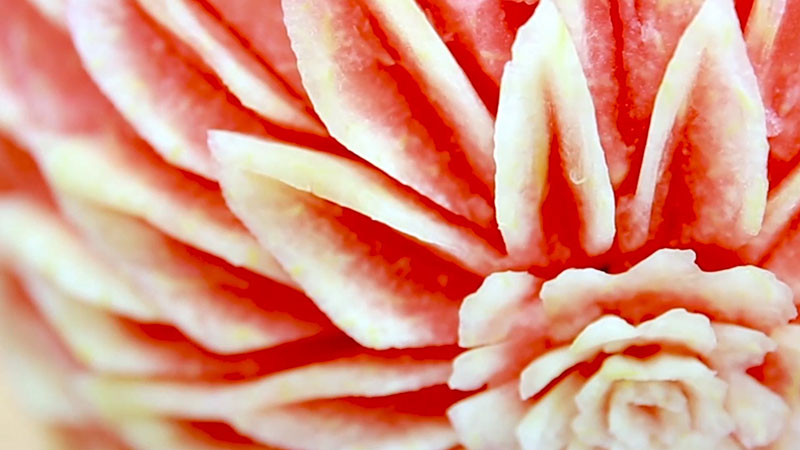 Dai people in China's Yunnan turn pieces of fruit into delicate artworks