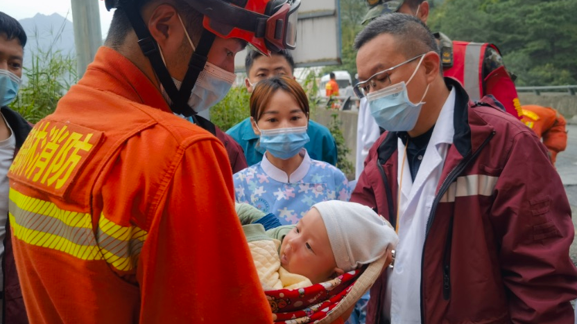 Young survivor of Wenchuan earthquake takes part in rescue efforts at site of Luding earthquake in Sichuan