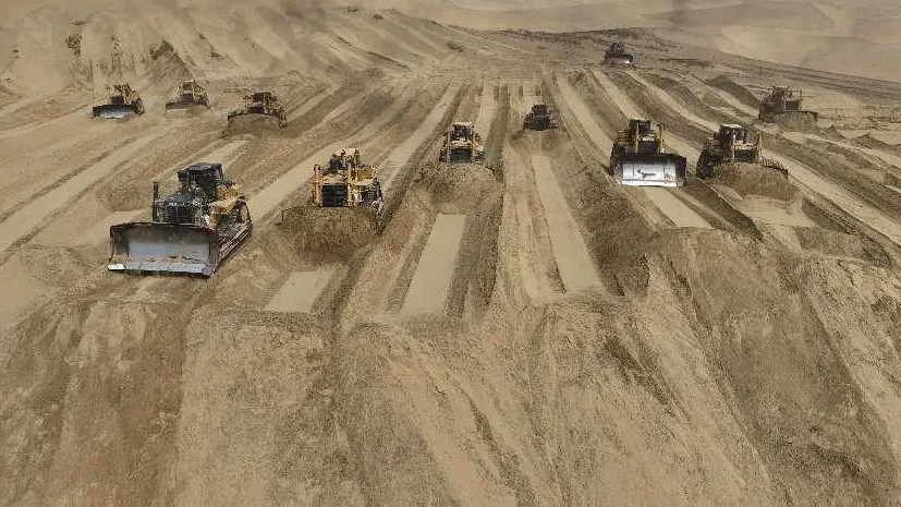 Desert highway under construction in Xinjiang