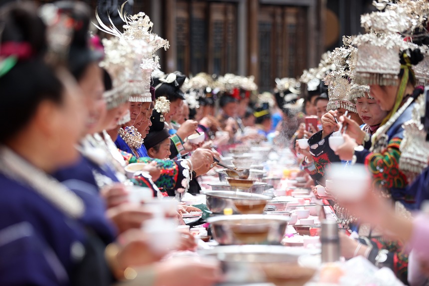 Miao people hold long-table banquet to celebrate traditional New Year in SW China's Guizhou