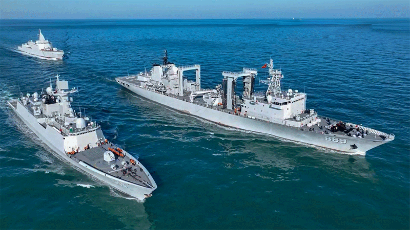 Chopper and supply ship engage in exercise