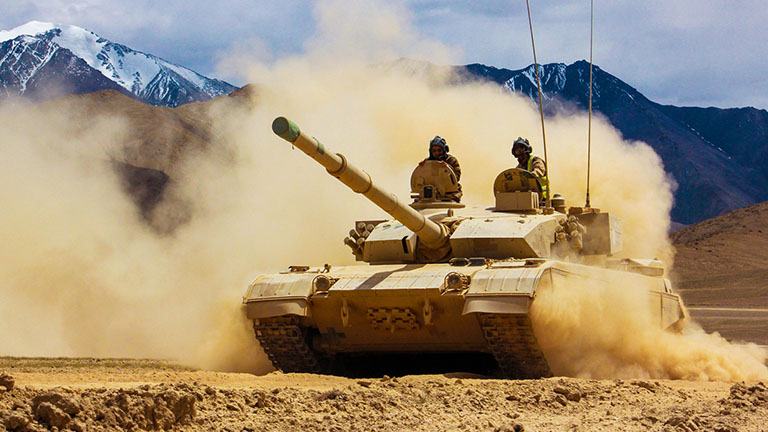 MBTs rumble through smoke and dust