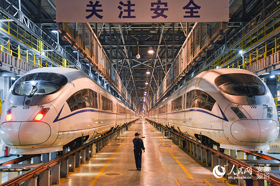 Young maintenance worker checks bullet trains for Spring Festival travel rush