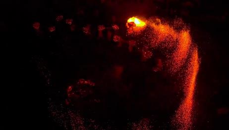 Fire phoenix illuminates night sky over She village