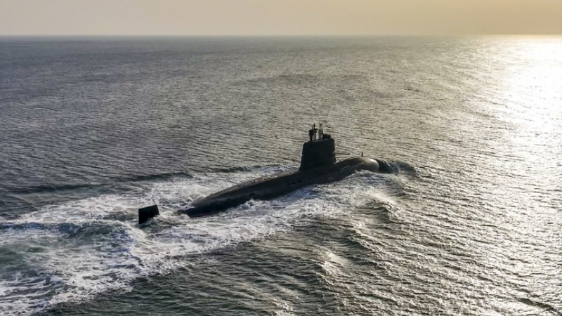 Submarine steams in sea