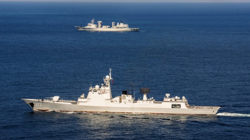 Special operations soldier fires heavy machine gun at mock targets