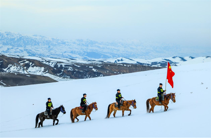 Police patrol borderline in NW China's Xinjiang