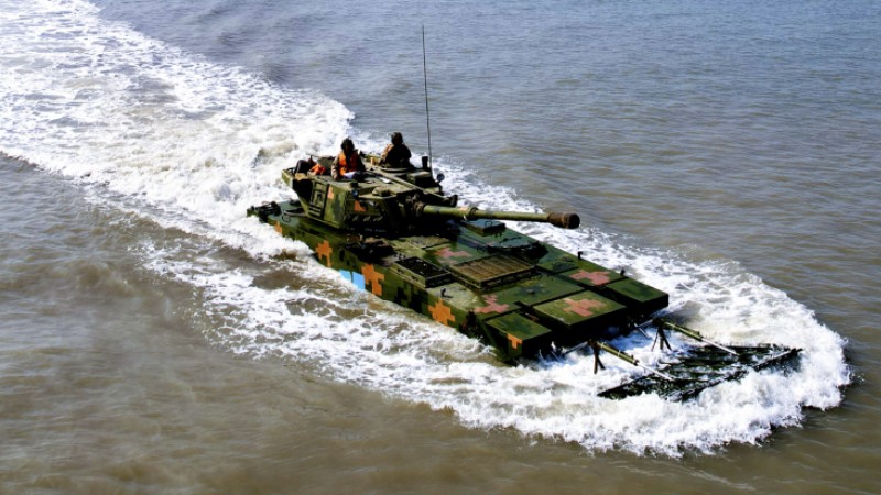 Amphibious armored vehicles maneuver in formation