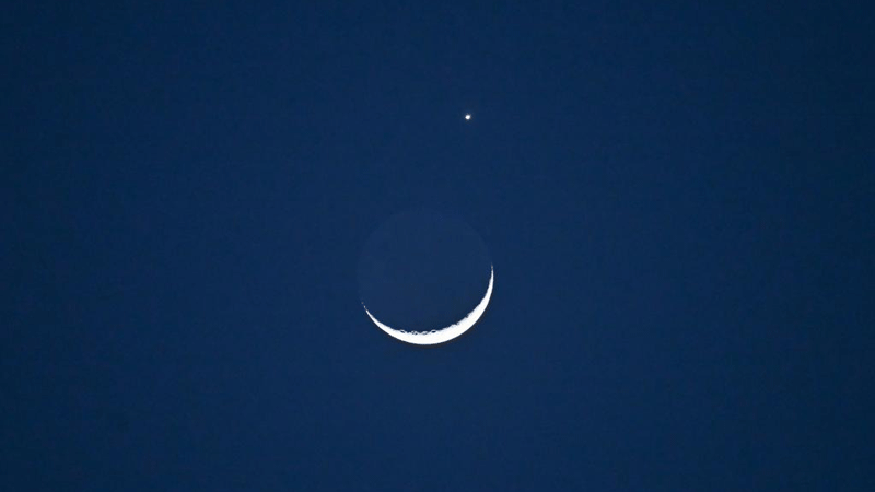 Lunar occultation of Venus pictured in Beijing