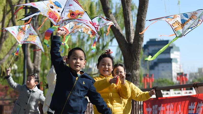 Tourists have fun at Taoranting park in Beijing