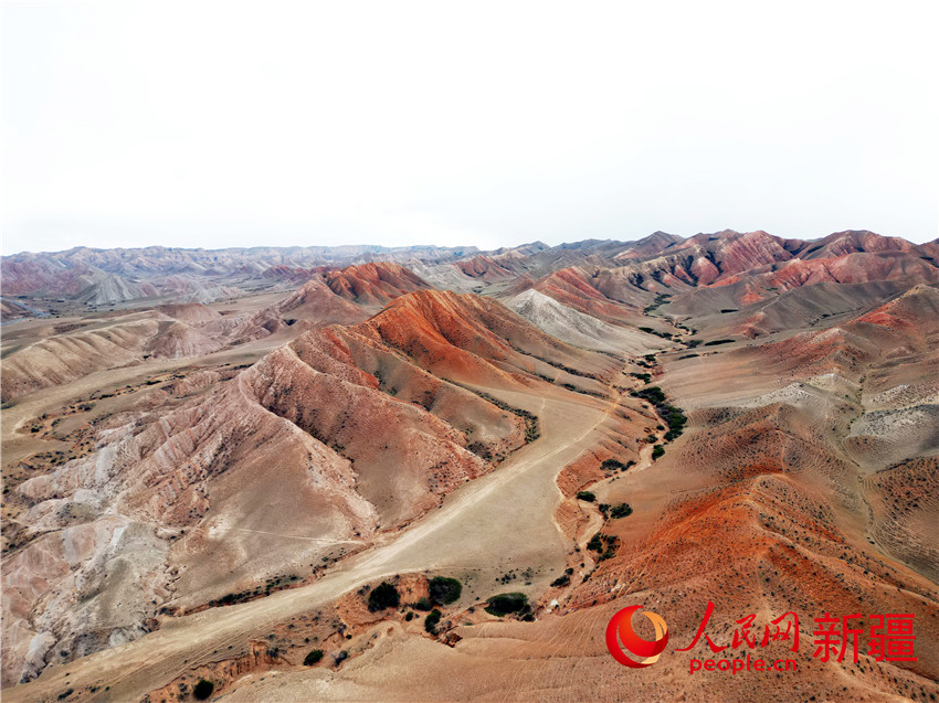 Picturesque Danxia landform along highway in NW China's Xinjiang