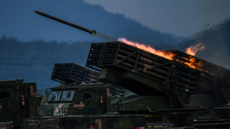 Vehicle-mounted multiple launch rocket system fires at mock target