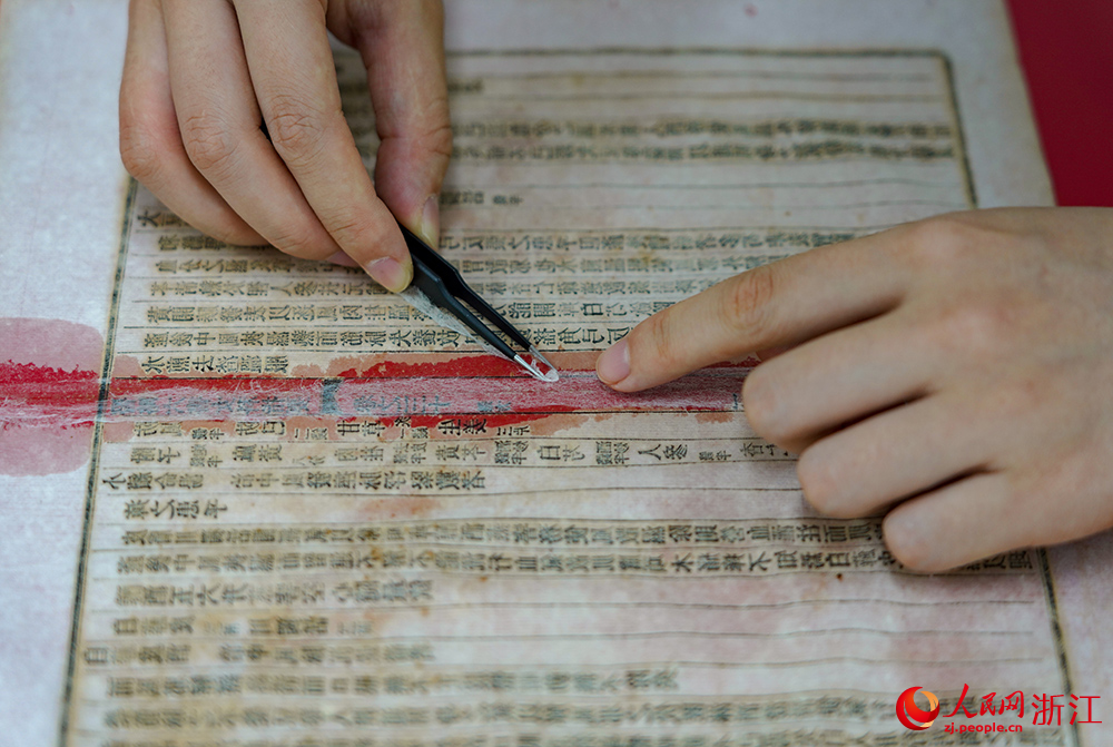 Repairers bring damaged ancient books back to life