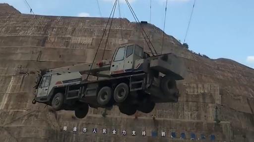 Heavy machinery transported overhead at Baihetan Hydropower Station construction site