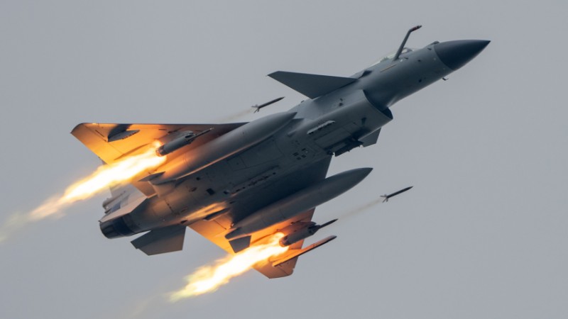 J-10 fighters launch missiles in live-fire flight training