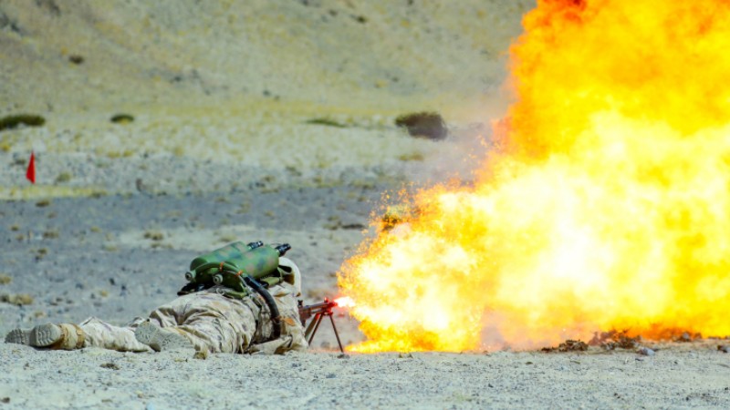 Flamethrower operator ignites controlled fire