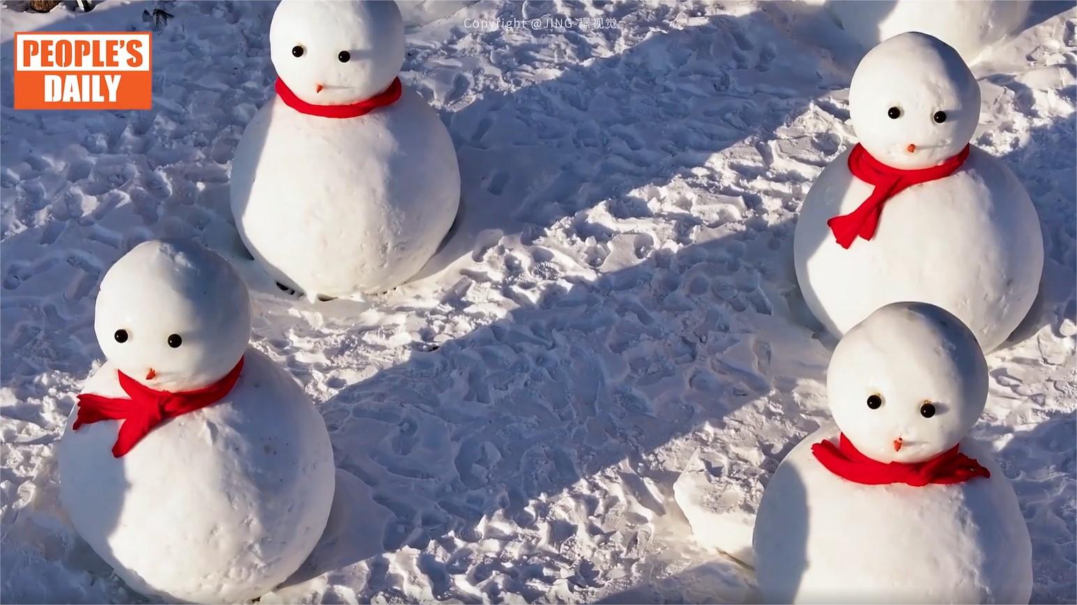 Charming squad of snowmen adorns scenic area in Jilin