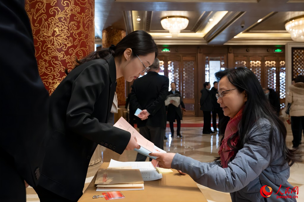 Chinese national lawmakers register for annual session in Beijing