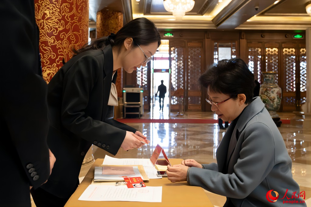 Chinese national lawmakers register for annual session in Beijing