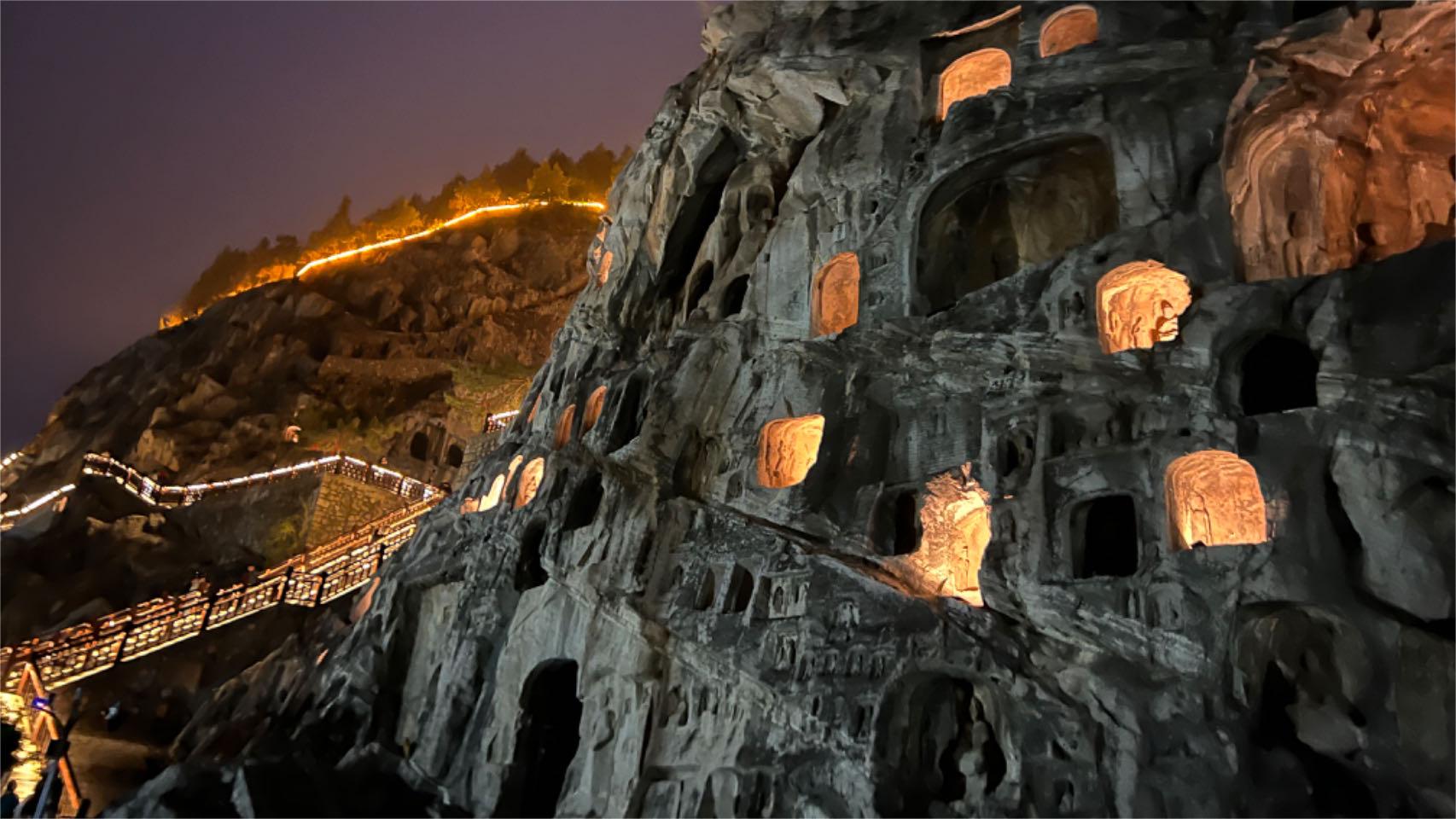 Embark on a mesmerizing night tour of Longmen Grottoes, C China's Henan