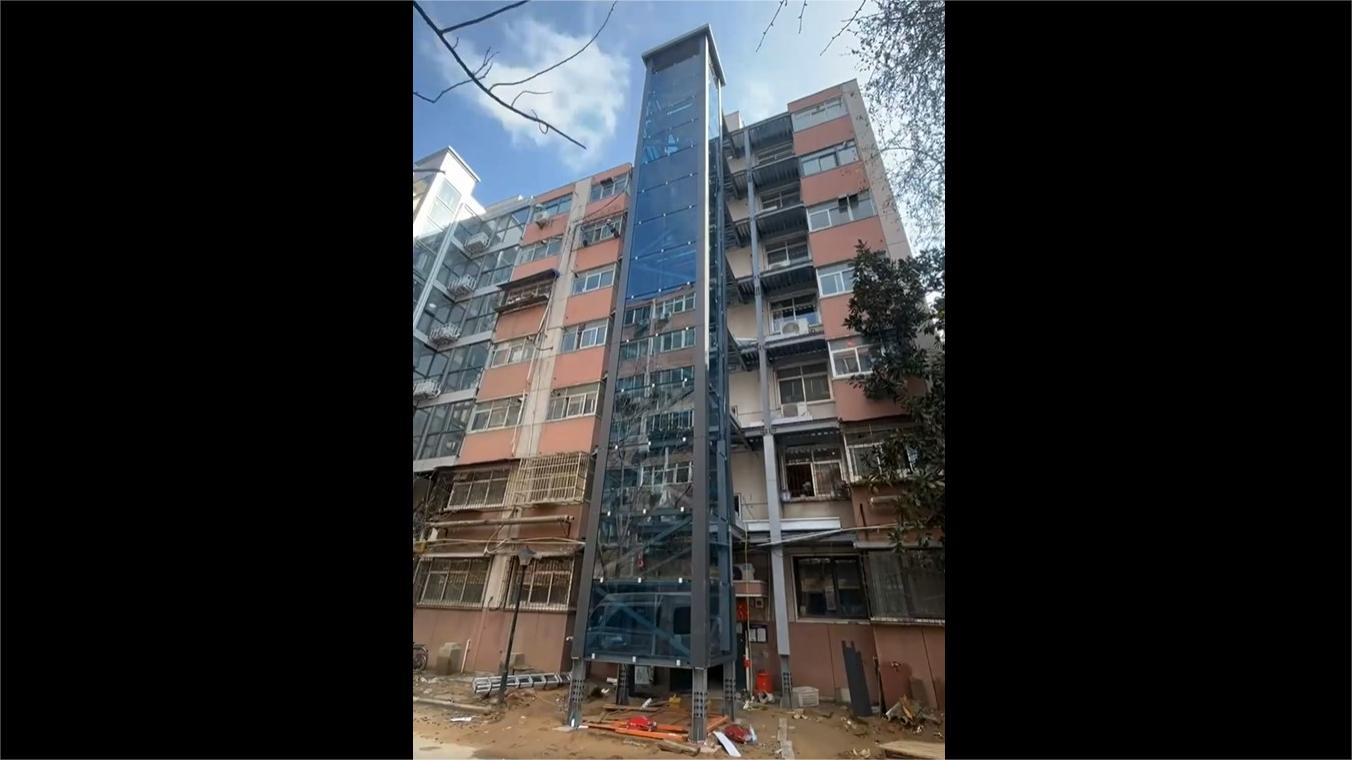 New elevator tower installed in old apartment building