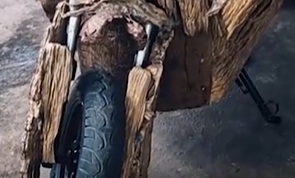 Sculptor turns motorcycle into 'wood chopper'