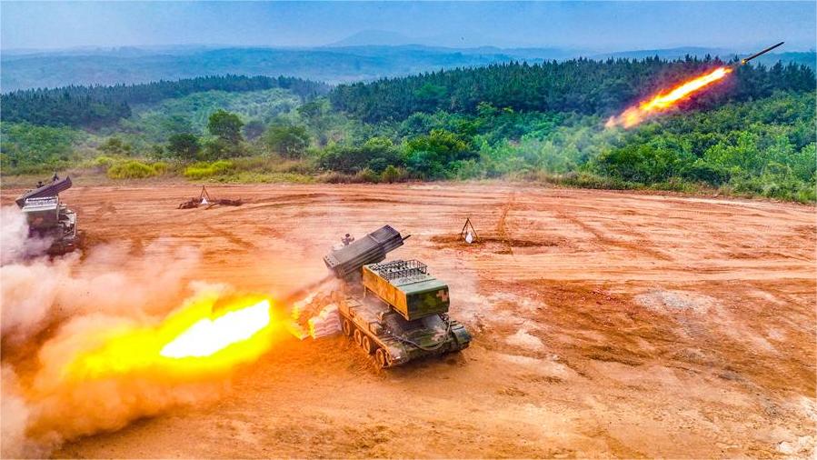 Armored vehicles spit fire