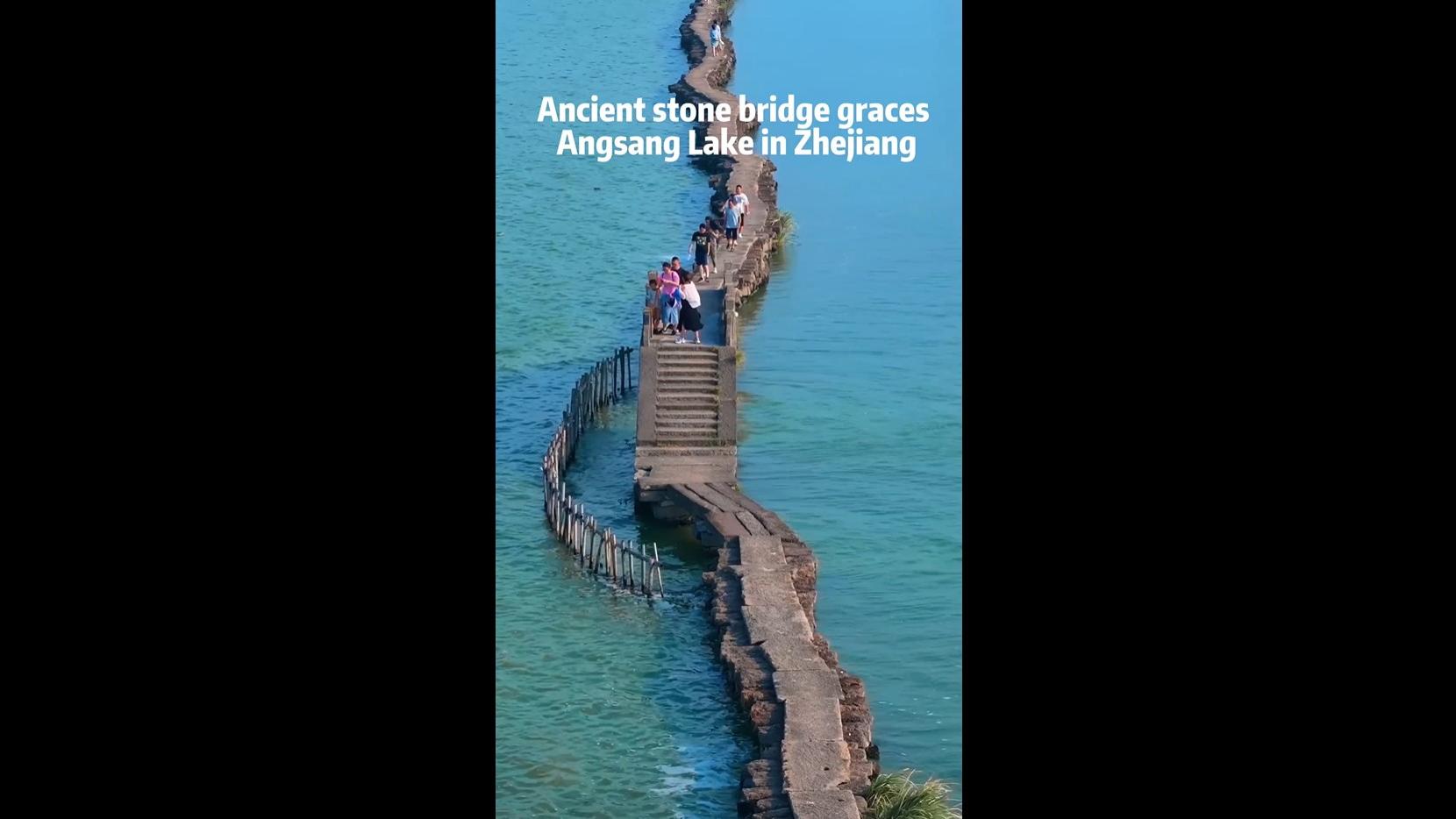 Ancient stone bridge graces Angsang Lake in Zhejiang