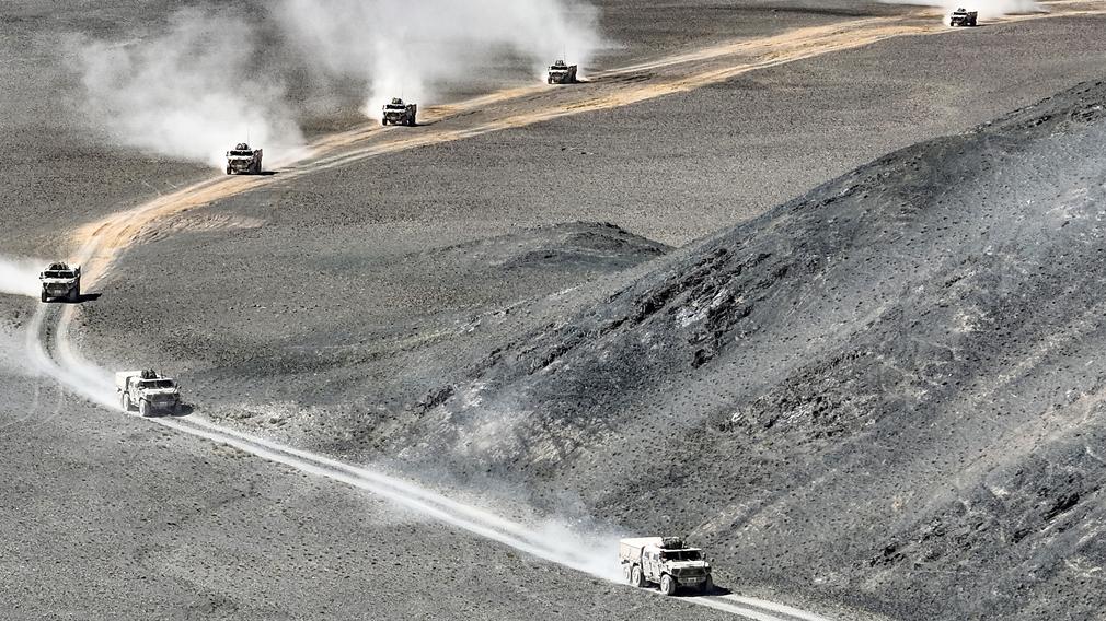 Military vehicles march in the field